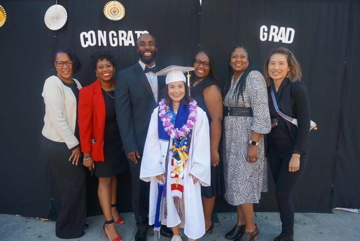Principal Orlando Johnson with graduating student and staff