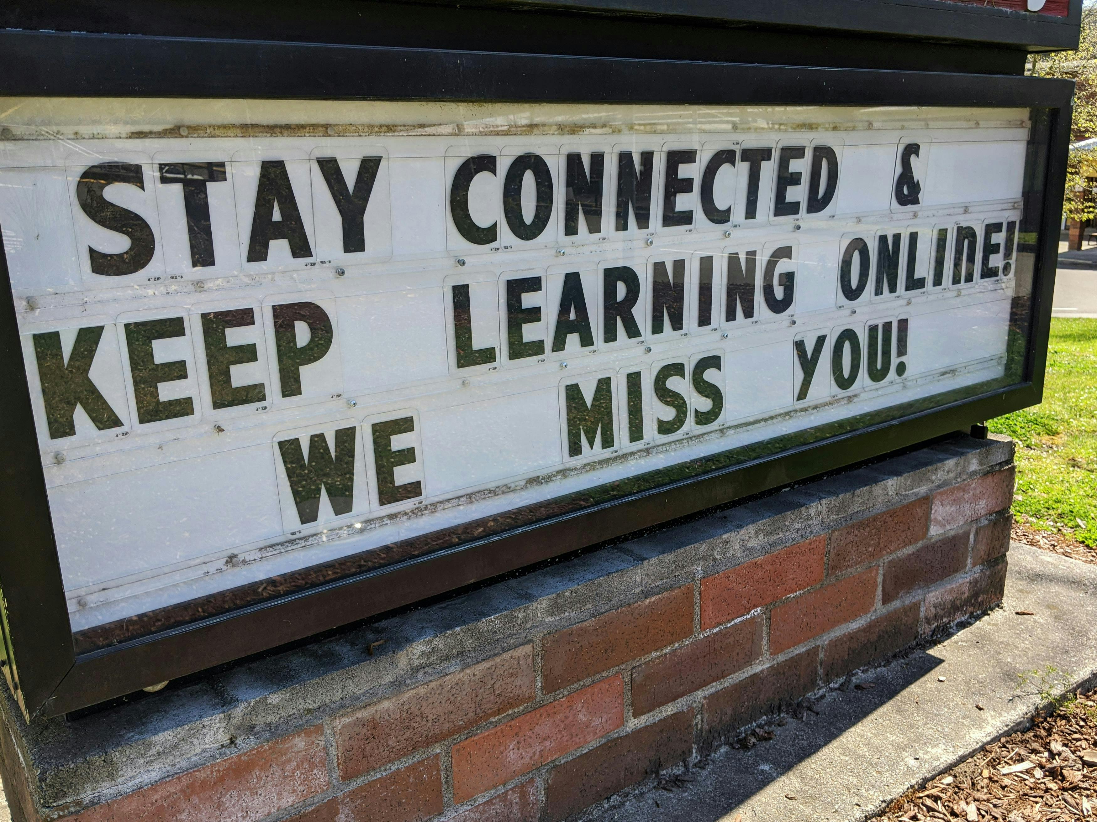 Marquis sign "Staying connected and keep learning online! We miss you!"