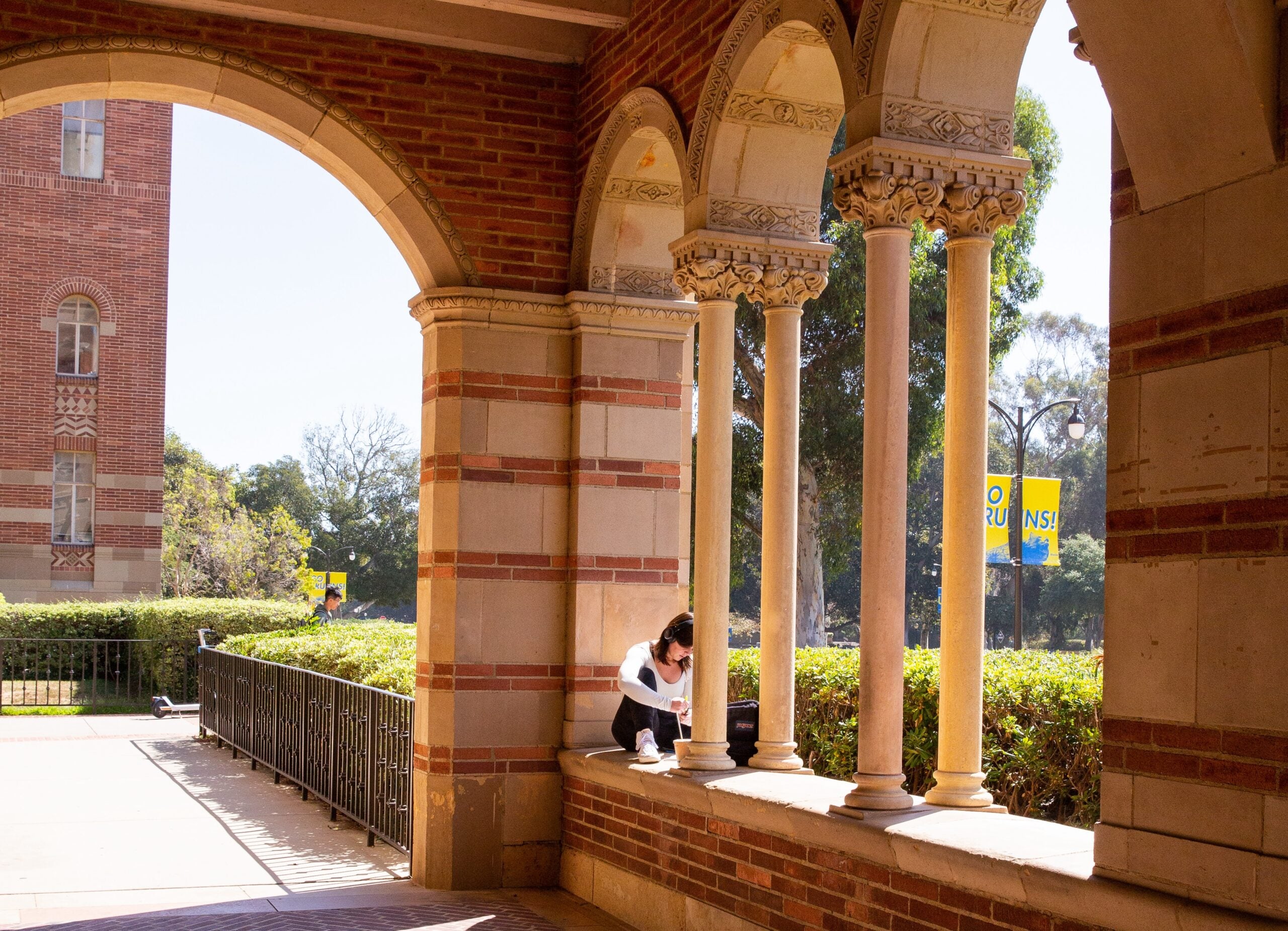 UCLA Campus Student in Royce Hall Columns