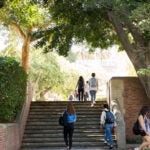 Students Walking Up Steps on Campus