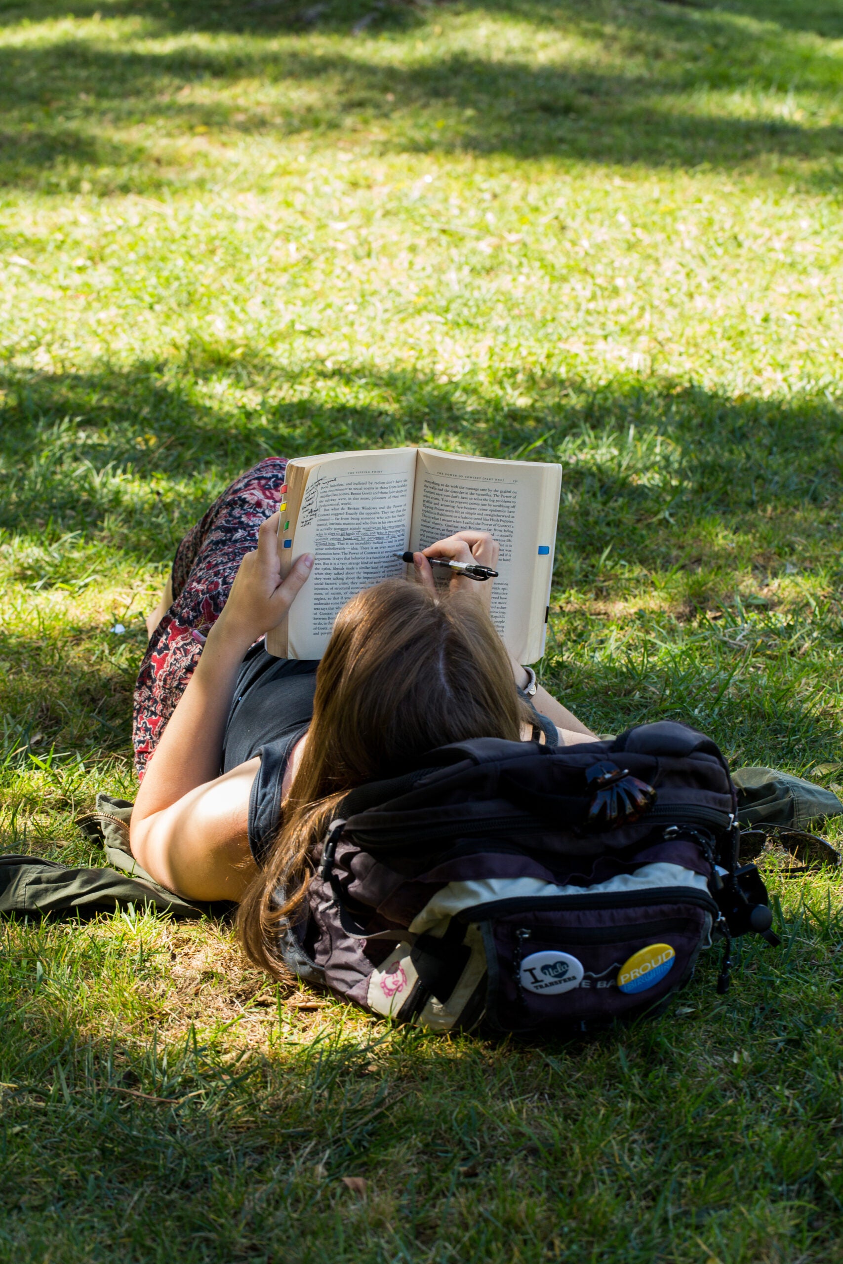 Student Studying on Grass