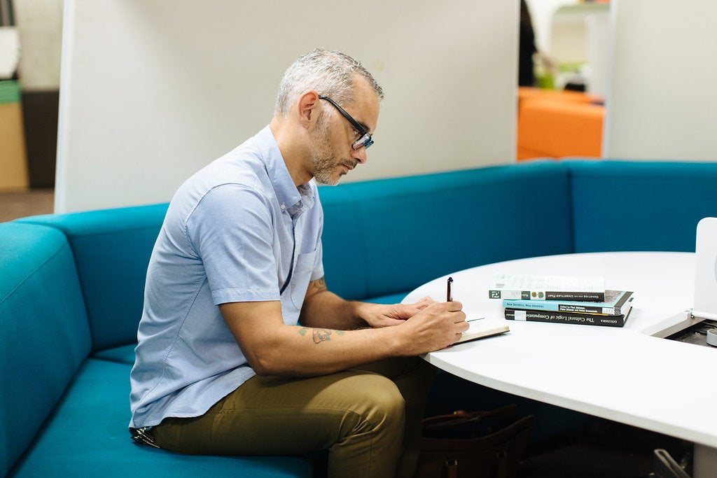 Student Sitting and Writing