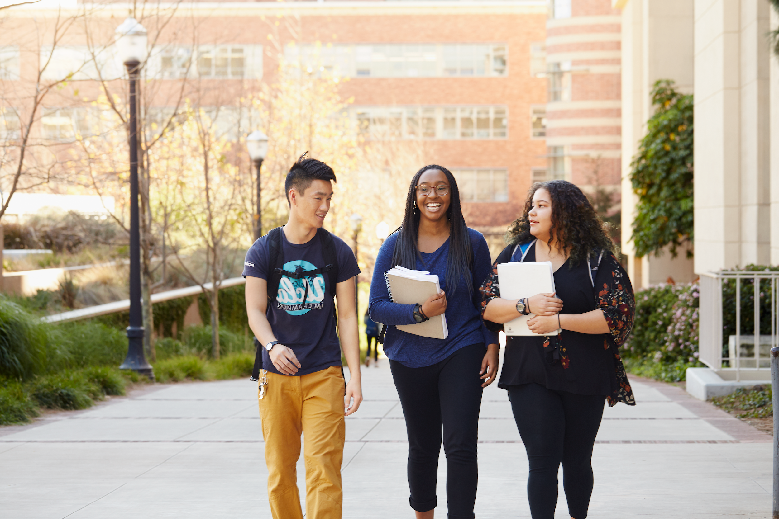 Three Students Walking on Campus