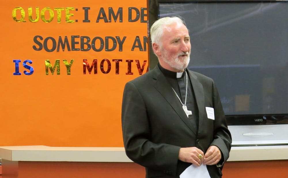 Bishop David O'Connell of the Los Angeles Archdiocese, led the panel discussion between LAPD officers and educators.