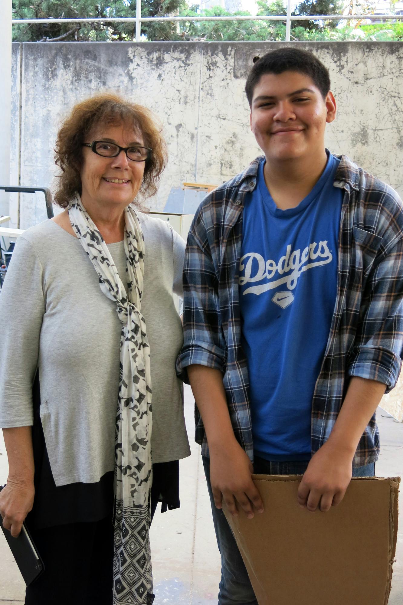 Barbara Drucker, SOAA Associate Dean of Community Engagement and Arts Education, and Michael Aguilar, a UCLA Community School student, discuss his project in the Broad Sculpture Lab at UCLA.