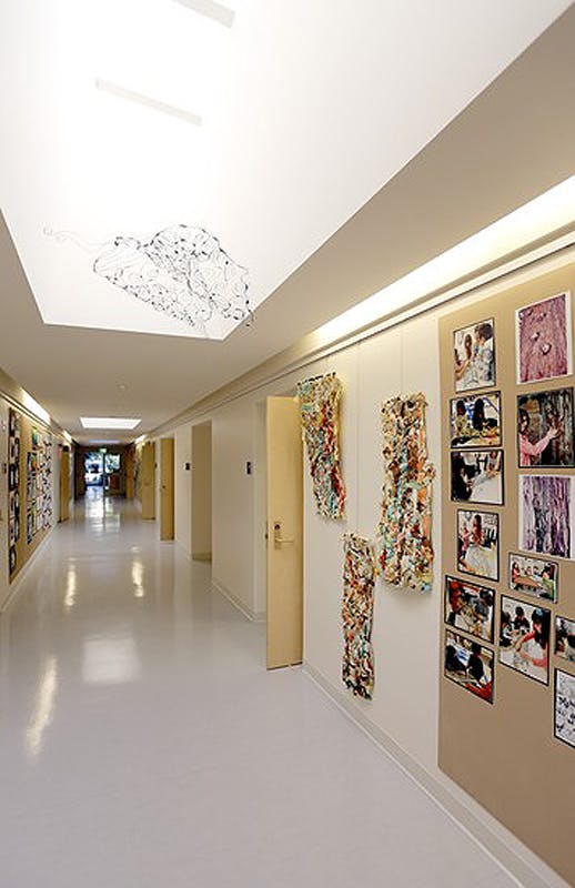 The lobby and reception area of UCLA Lab School welcomes visitors and showcases students' art and work.