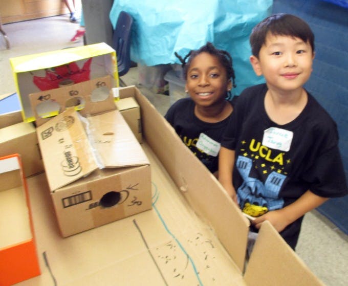 Adanma Okoro (at left) and Jayden Kim built their own game using the engineering process during a UCLA Young Scholars STEM workshop.