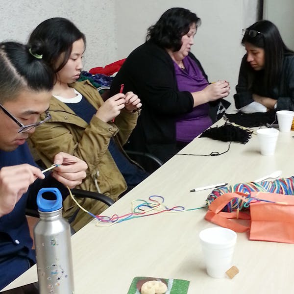 TEP student Imelda Rivas (second from right), leads a workshop on crocheting, a skill handed down to her by her mother and grandmother. Photo by June Chou