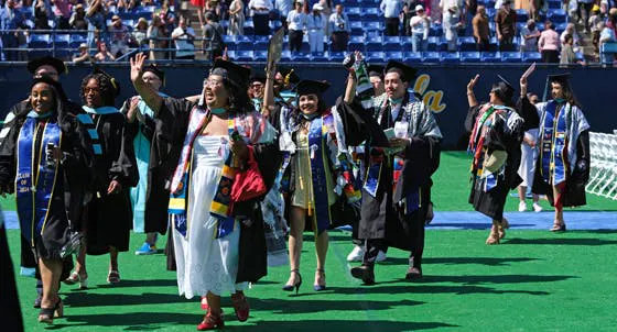 Small group waving at graduation