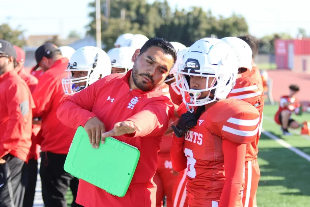 Erik Padilla coaching football player