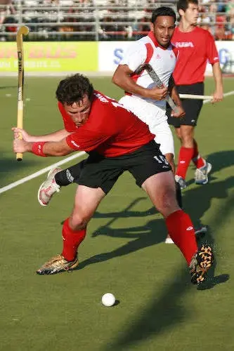 Patrick Cota playing field hockey