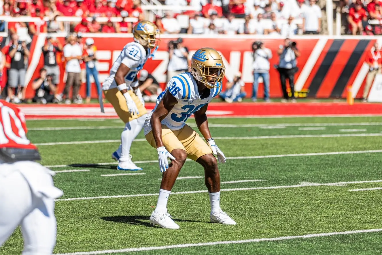 Alex Johnson playing football for UCLA