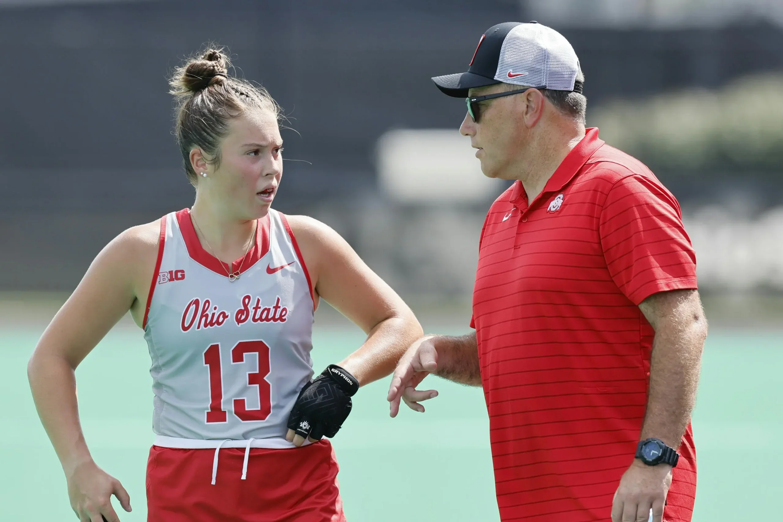 Patrick Cota coaching field hockey player at OSU