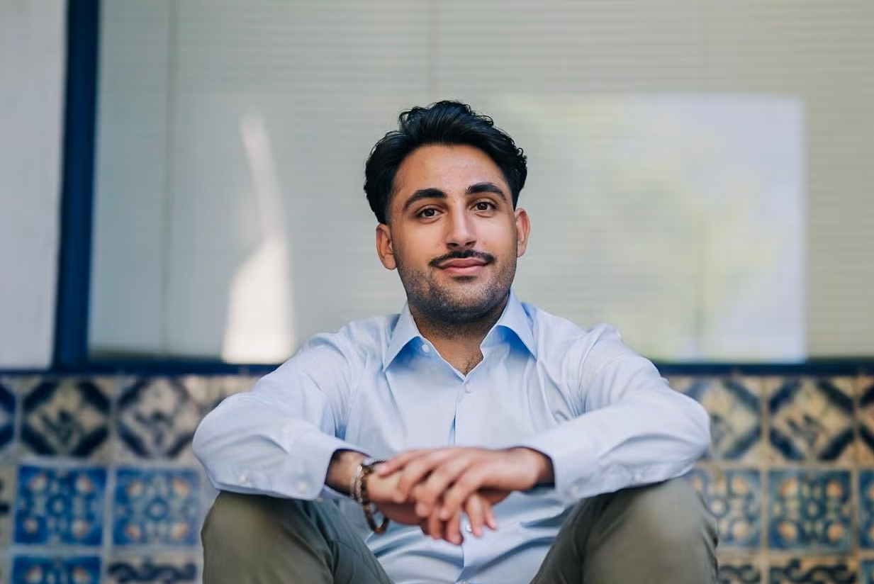 Matthew Rahban sitting on steps