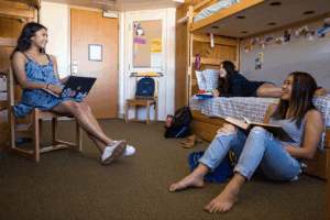 Students sitting in dorm
