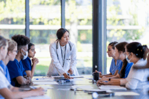 Doctor speaking with students