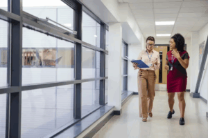 Two women walking and talking